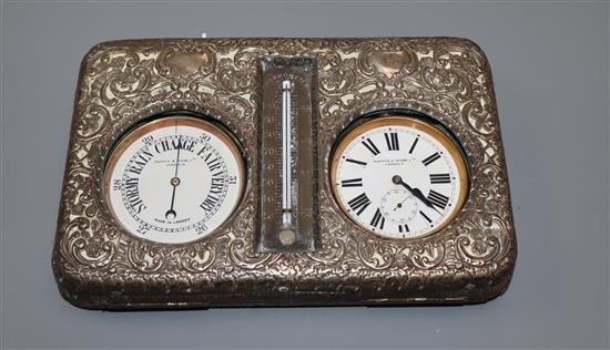 An Edwardian repousse silver mounted combination pocket watch, barometer and thermometer desk stand (a.f.).